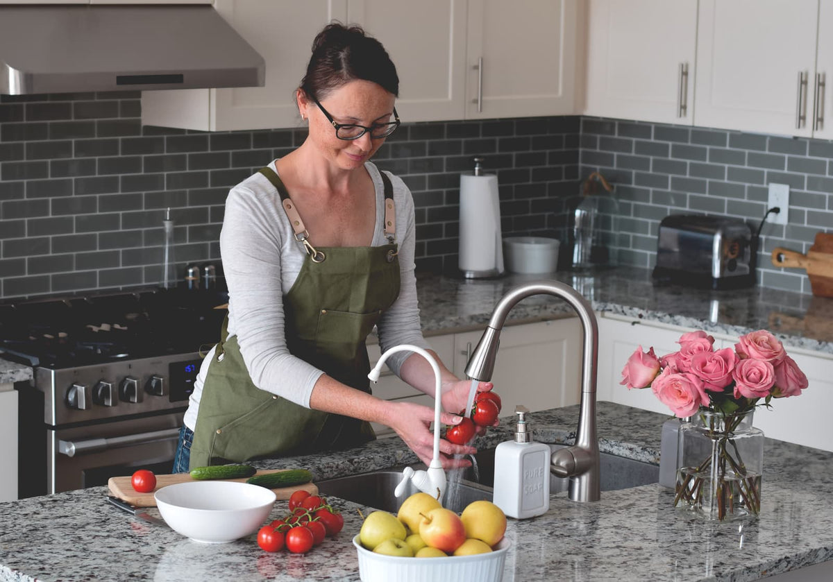 Separate drinking-water faucet installed beside a kitchen faucet on granite countertop