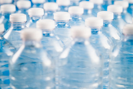 Rows of bottled water raise the question of whether commercial bottled water is sterile.