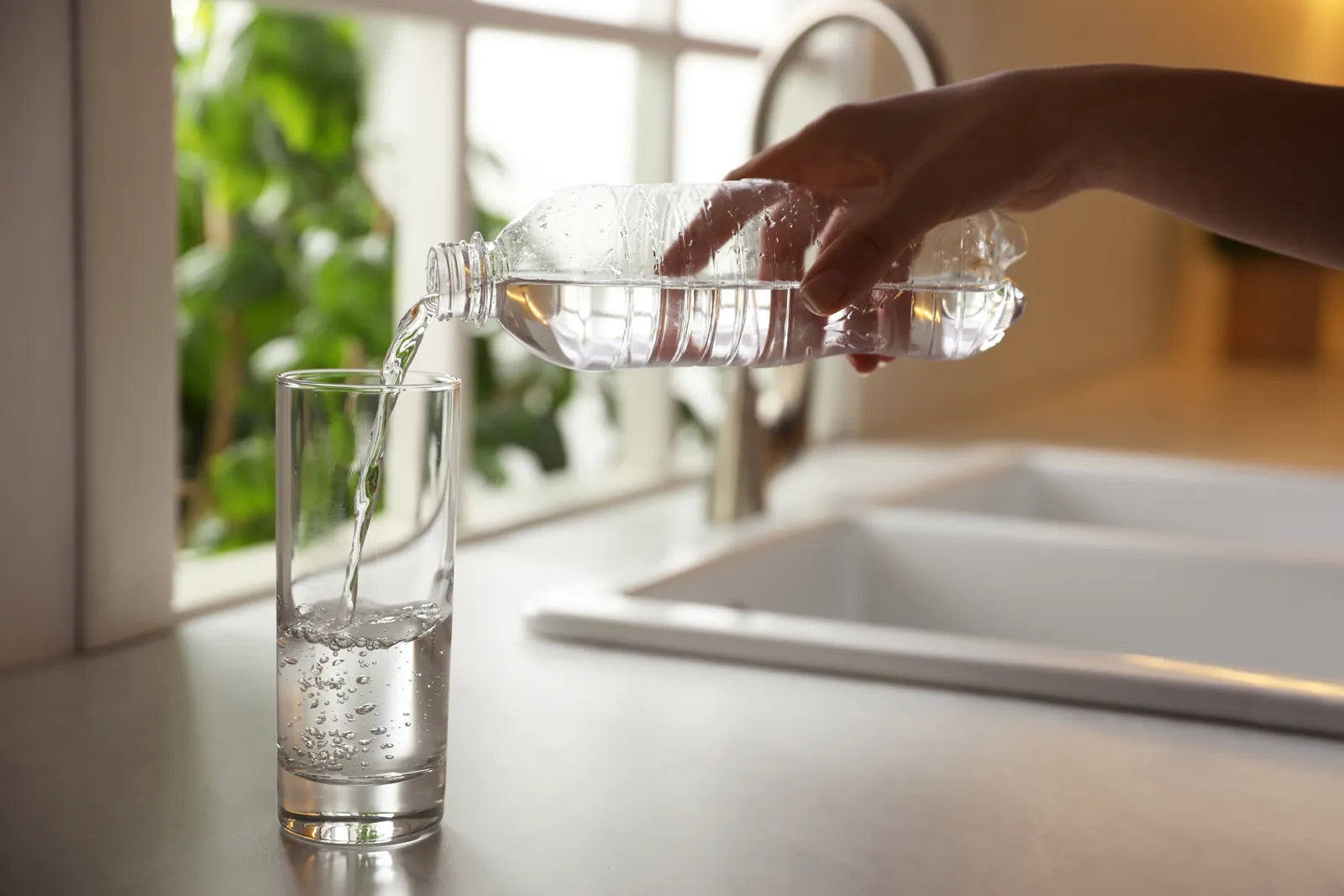 Clean poured drinking water highlights quality differences between filters and bottled delivery.